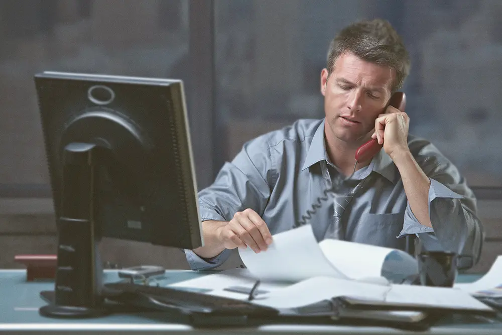 Business owner on the phone managing the many demands of running a business.