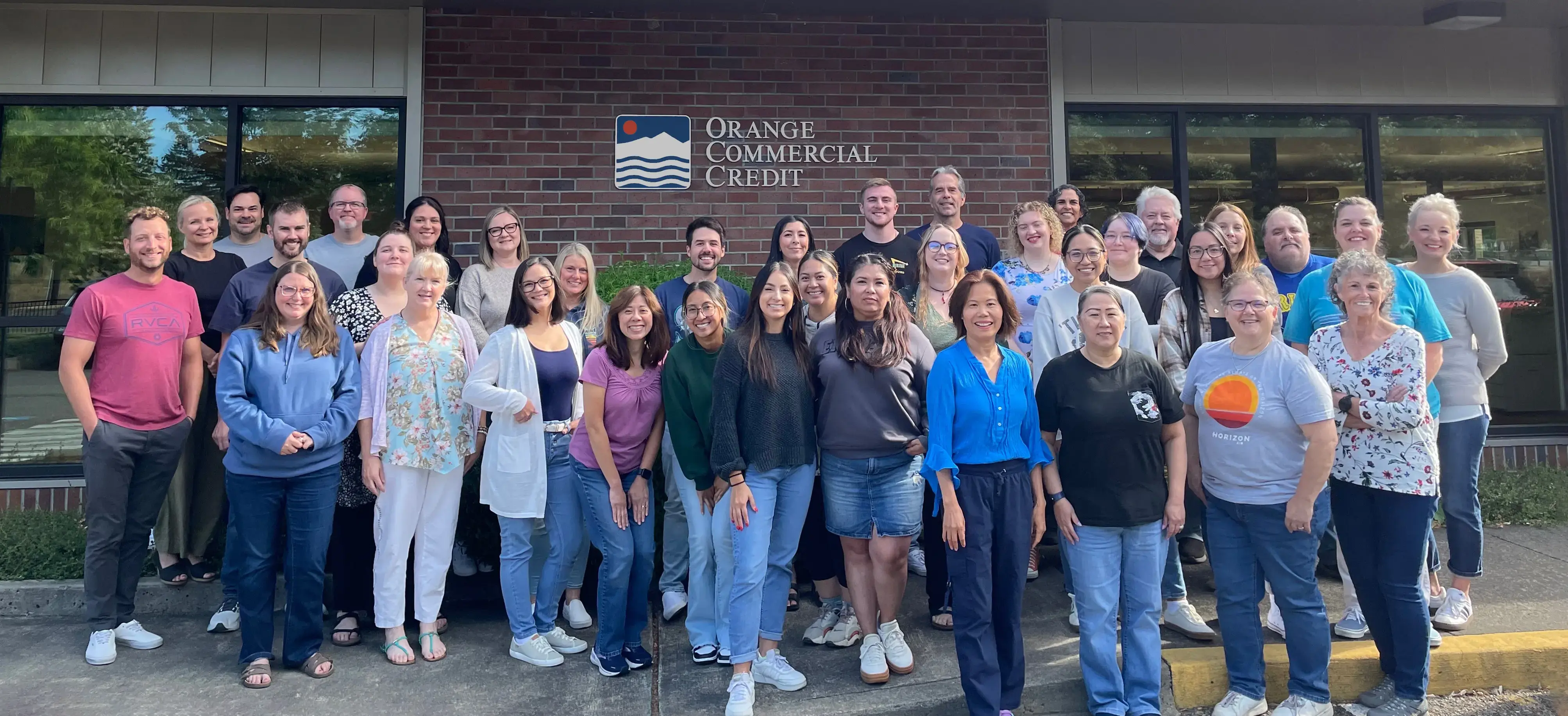 Orange Commercial Credit's fabulous team members gathered outside headquarters in Olympia Washington for a group photo.